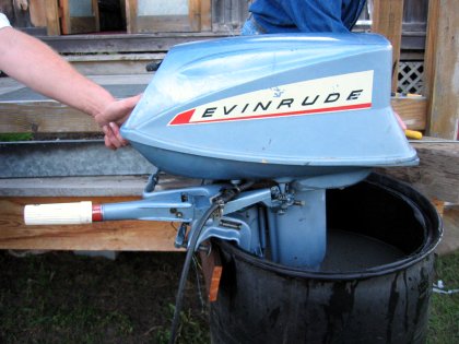 Evinrude outboard in a barrel