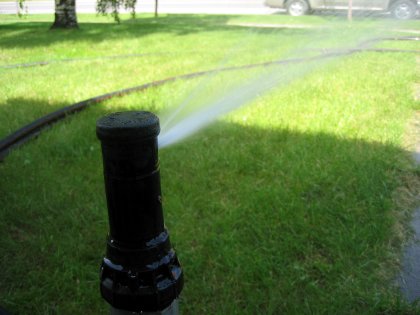 A Hunter PGP Pop-Up Sprinkler in action