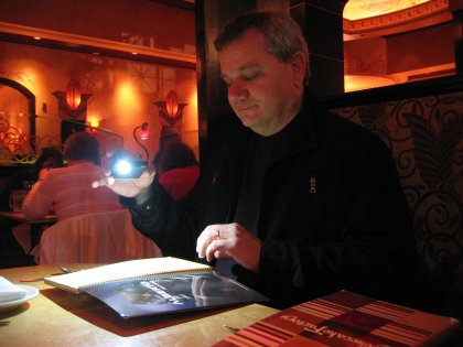 Due to the ambiance in this restaurant, Jeff needed to use his phone's light to read the menu