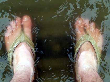 My feet in the waters of Lake Keho