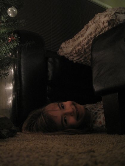Peeking out from under the couch