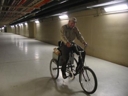 Pat riding a bike through the tunnels of the Bonnybrook Waste Water Treatment Plant