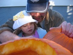 Bo and Maddy carving their pumpkin