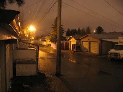Long exposure shot of the back alley in the rain