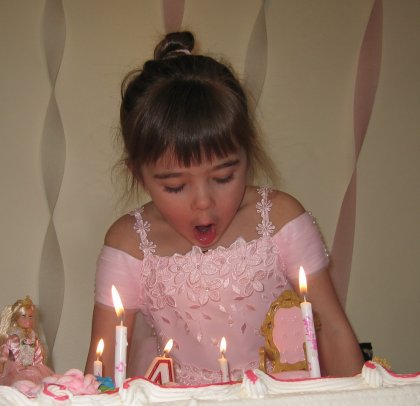 Maddy blows out her birthday candles