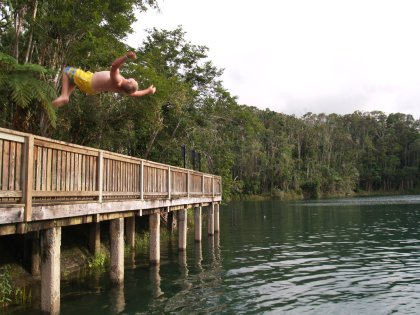 Bo doing a backflip off the fence by the lake
