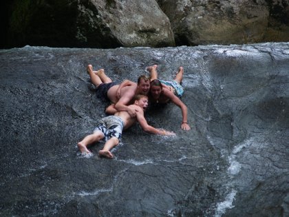 Some crazy English blokes performed a variety of human stunts while sliding down the rock
