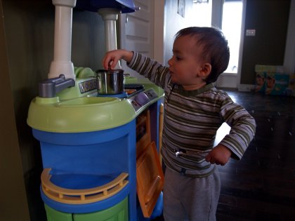 Our little chef checks his soup